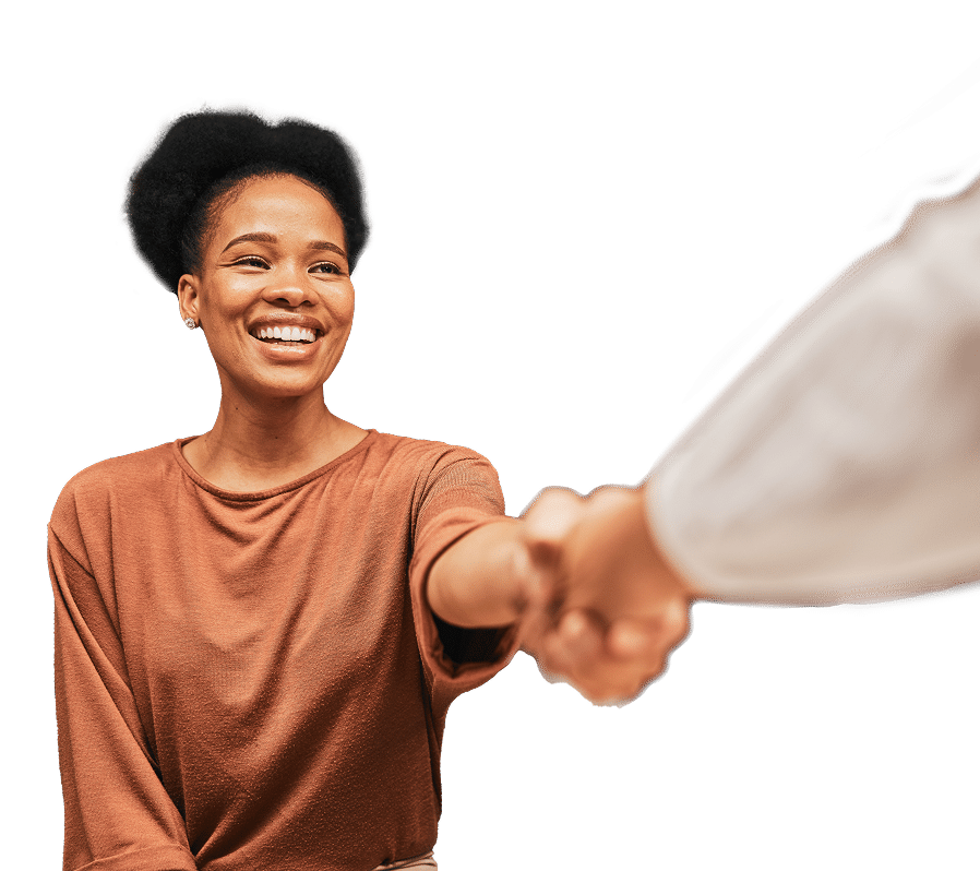 A smiling woman reaches out her hand for a handshake.